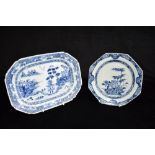 A CHINESE EXPORT DISH DECORATED WITH FIGURES AND BUILDINGS IN A COASTAL LANDSCAPE 30cm wide; and