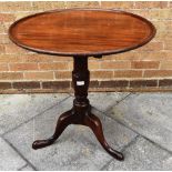 A 19TH CENTURY MAHOGANY TILT TOP TRIPOD TABLE the circular try top, 69cm diameter, 71cm high