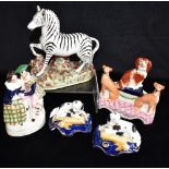 A GROUP OF STAFFORDSHIRE CERAMICS comprising Zebra, courting Highland group 'Highland Mary', pair of