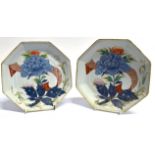 A PAIR OF CHINESE PORCELAIN PLATES of octagonal form, enamelled floral decoration heightened in