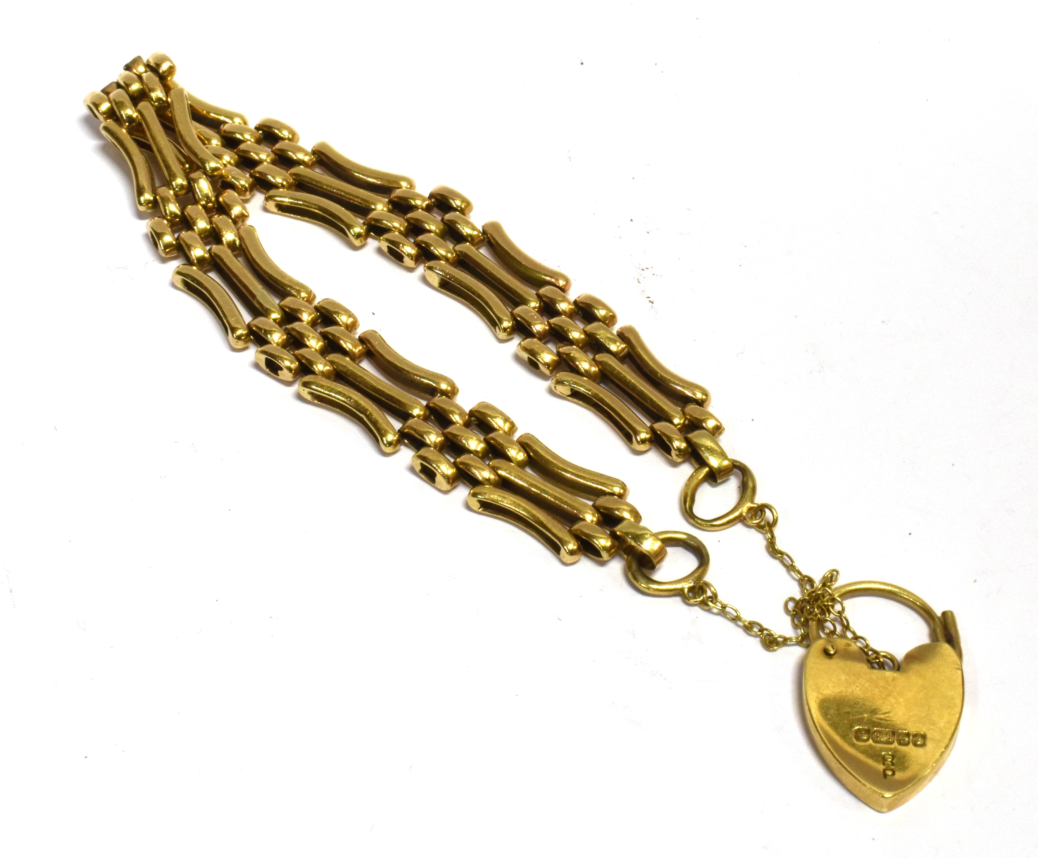 A 9CT GOLD GATE BRACELET with padlock fastener, the three bar gate links with seven small belcher - Image 2 of 2