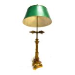 A PATINATED BRASS TABLE LAMP the sliding shade with an arrow-flight adjuster, the Corinthian