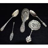 FIVE ITEMS OF SILVER WARE Comprising a Georgian berry spoon (a possible later conversion) Hallmarked