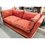 A CRIMSON UPHOLSTERED FAUX KNOLE SOFA with a non-adjustable rigid frame, overall 97cm high, 213cm