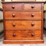 A VICTORIAN MAHOGANY CHEST OF DRAWERS comprising two short over three graduated long drawers, with