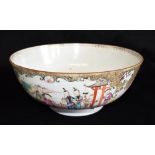 A CHINESE PORCELAIN PUNCH BOWL enamelled decoration of figures in a garden setting, 31.5cm diameter,