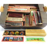 APPROXIMATELY 170 COLOUR-PRINTED MAGIC LANTERN STRIP SLIDES the largest 28cm long.