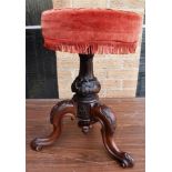 A VICTORIAN CARVED ROSEWOOD PIANO STOOL with a pleated upholstered top, 49cm high.