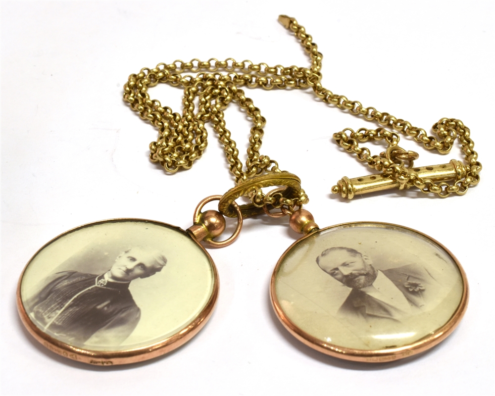 A PAIR OF EDWARDIAN 9CT GOLD FRAMED PICTURE PENDANTS and chain, the glazed pendants hallmarked 1906,