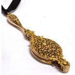 A PAIR OF YELLOW METAL LORGNETTES the ornate scroll and leaf filigree design, with push button