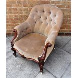 VICTORIAN UPHOLSTERED BUTTON BACK ARMCHAIR, the cabriole front supports with carved scrollwork