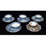 FOUR CHINESE TEA BOWLS AND SAUCERS of octagonal form, underglaze blue decoration within diaper