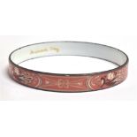 A MICHEALA FREY ENAMELLED METAL SLAVE BANGLE the round bangle 9mm wide with pink and white enamelled