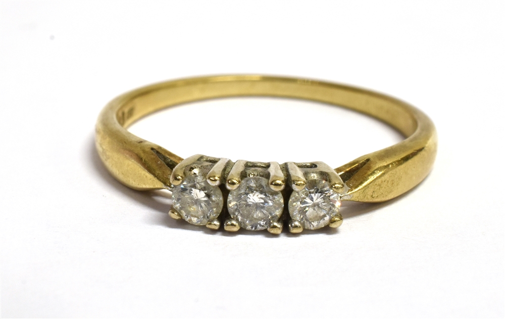 A DIAMOND THREE STONE 9CT GOLD RING the three brilliant cut diamonds with a total diamond weight