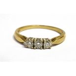 A DIAMOND THREE STONE 9CT GOLD RING the three brilliant cut diamonds with a total diamond weight