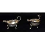 TWO GEORGIAN SILVER SMALL SAUCEBOATS of traditional form on three paw feet with scroll boarder,