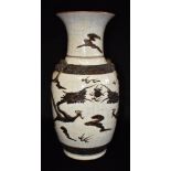 A LARGE CHINESE CRACKLE GLAZE BALUSTER SHAPED VASE relief decorated with a dragon, mask ring