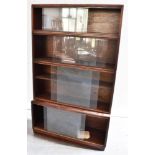 20th CENTURY SIMPLEX FOUR SECTION STACKABLE BOOKCASE, each section with glass sliding doors, with