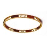 A 9CT ROSE GOLD CORNELIAN SET SLAVE BANGLE the large round bangle with tablets of cornelian,