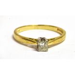 A SMALL DIAMOND SOLITARIE 18CT GOLD RING The square princess cut diamond 0.25 carat stamped, ring