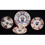 AN IMARI CHARGER the centre decorated with a vase of flowers, the border with reserves painted