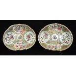 A PAIR OF CHINESE CANTON FAMILLE VERTE SHAPED OVAL DISHES decorated with figures in court setting