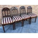 FOUR 20TH CENTURY DINING CHAIRS, with domed shaped backs and a central heart shape cut out to the