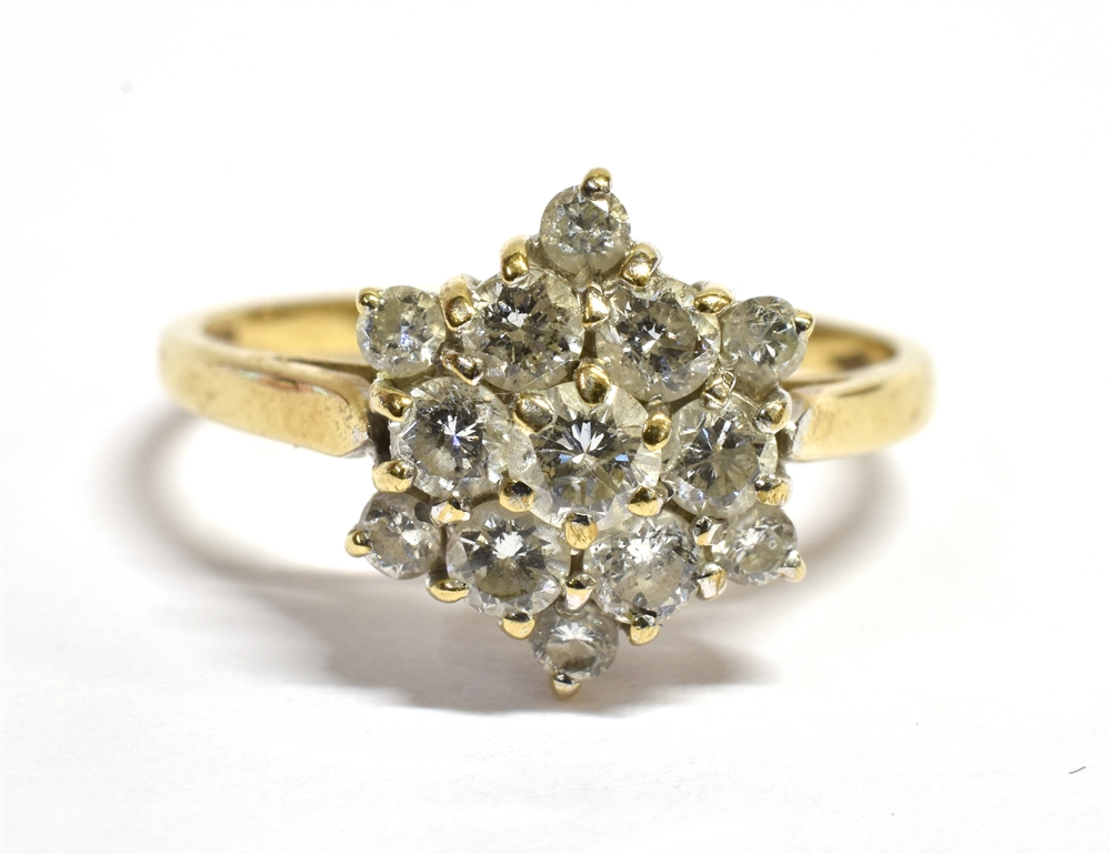 A DIAMOND CLUSTER 9CT GOLD RING flowerhead cluster, the round brilliant cut diamonds, weighing a