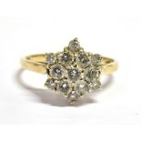 A DIAMOND CLUSTER 9CT GOLD RING flowerhead cluster, the round brilliant cut diamonds, weighing a