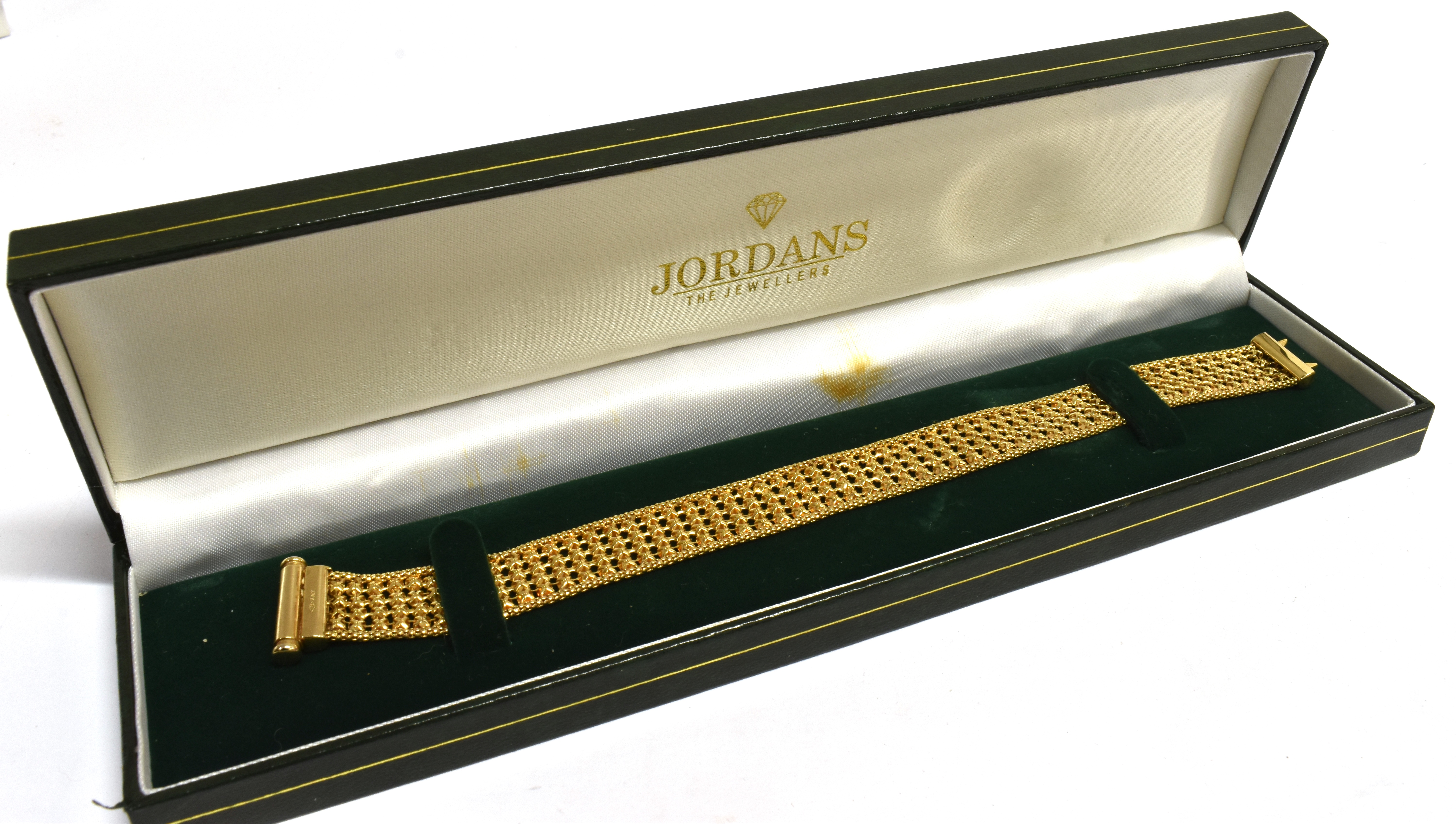 A 9CT GOLD FANCY LINK BRACELET the four row bracelet with octagonal shaped links to a tubular sprung