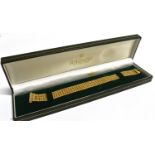 A 9CT GOLD FANCY LINK BRACELET the four row bracelet with octagonal shaped links to a tubular sprung