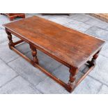 OAK LOW COFFEE TABLE, the plank top raised on six legs each united by a stretcher, 46cm x 69.5cm x