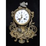 A 19TH CENTURY FRENCH JAPY FILS ROCOCO STYLE GILT METAL MANTLE CLOCK the enamel dial with Roman
