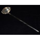 A GEORGIAN SILVER TODDY LADLE With coin bottom and whale bone twist handle with oval bowl and double