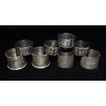 FOUR SILVER NAPKIN RINGS Two pairs of each total weight approx. 5.2 ozt (164 grams) together with