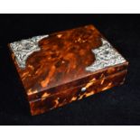 A SMALL TORTOISESHELL RECTANGULAR DRESSING TABLE BOX Two corner sections of embossed leaf and scroll