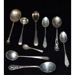 NINE ASSORTED SMALL SILVER SPOONS Comprising teaspoons, condiment spoons and a modern seal top