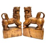 A PAIR OF CARVED HARDWOOD DOGS OF FO, 46cm high