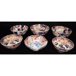 SIX IMARI BOWLS including a bowl of pentagonal form decorated to the centre with a figure in a