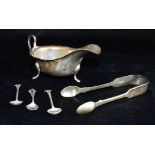 TWO ITEMS OF SILVER comprising a small 20th century sauce boat and a pair of Victorian sugar tongs