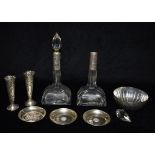 FIVE ITEMS OF SILVER Comprising a pair of large cut glass scent bottles with silvers collars, a pair