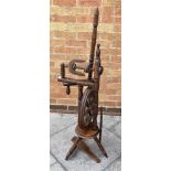 AN OAK SPINNING WHEEL, 120cm high