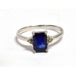 A SINGLE STONE 9CT WHITE GOLD RING WITH BLUE KYANITE very small diamonds to shoulder the rectangular