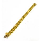 AN 18CT YELLOW GOLD BRACELET the stylised heart shaped links to tongue snap clasp fastener, 19cm