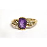 W2876-2A 9CT GOLD AMETHYST SINGLE STONE DRESS RING with very small diamonds, set to cross over