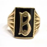 A 9CT GOLD INITIAL 'B' SIGNET RING The black onyx set head with applied initial B grooved pierced