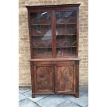 VICTORIAN MAHOGANY BOOKCASE CABINET, with moulded cornice above two glazed doors opening to reveal