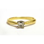 A DIAMOND SOLITAIRE 18CT GOLD RING The millennium cut diamond approx. 0.25 carat claw set to