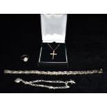 A 9CT GOLD SMALL CROSS AND TRACE CHAIN the cross of hollow construction, together with a silver