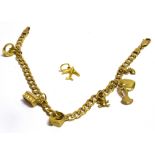 A 9CT GOLD CHARM BRACELET with seven small charms (one loose), the flat curb link bracelet to a